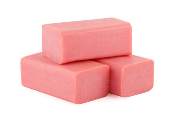 three pieces of pink handmade soap isolated on white background