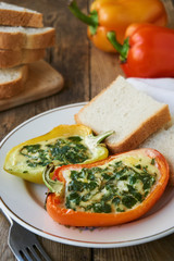 Fototapeta na wymiar Baked bell pepper with egg and parsley on a plate 