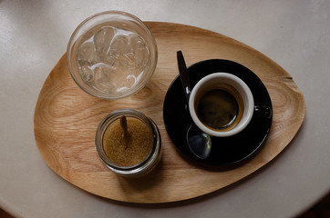 Hot coffee with brown sugar and water with ice