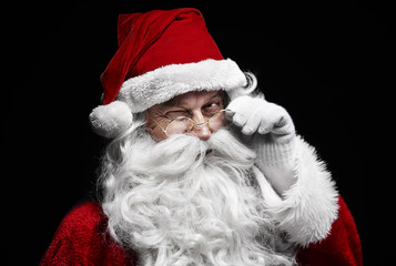 Man in santa claus costume winking