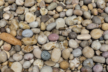 Sea stones. Stone background for tiles, facades of houses.
