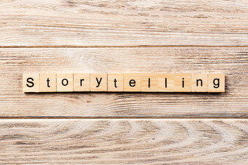 storytelling word written on wood block. storytelling text on table, concept