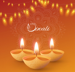 Orange shiny Happy Diwali card with oil lamps.