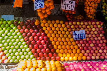Rows of apples and oranges at a market in Colombo, Sri Lanka