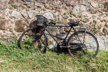 Fototapeta na wymiar Bicycle and an old fortification wall in Galle, Sri Lanka