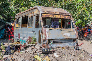 Old rusty bus in the center of Delhi, India.