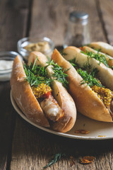 Hot dogs with mustard and chopped dill