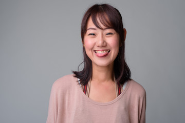 Fototapeta premium Portrait of beautiful Asian woman with hair tied