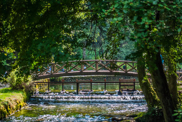 Fototapeta na wymiar Beginning river Bosna at Nature park Vrelo Bosne