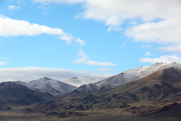 Fototapeta na wymiar Natural beauty of the snow mountains in the Ulgii city, Mongolia