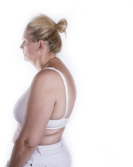 Mature woman with poor back posture. Backpain concept