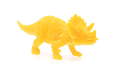 triceratops made out of plastic. dinosaur toy isolated on white background
