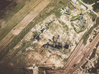Aerial view of open pit excavator and other machinery