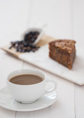 carrot cake with coffee on white