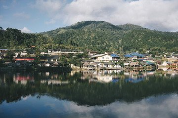 Fototapeta premium Landscape of beautiful lake in the morning at Ban Rak Thai, North of Thailand