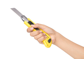 hand holding yellow cutter knife isolated on white background