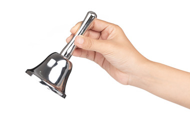 hand holding silver hand bell isolated on a white background.