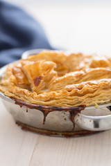 meat pie with stew of chicken , mushrooms,peas puff pastry tasty homemade dish