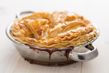 meat pie with stew of chicken , mushrooms,peas puff pastry tasty homemade dish