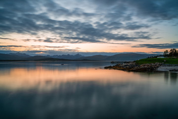 View of the fjord from Tromso on the island of Tromsoja, Norway during sunset