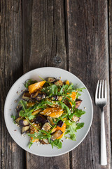 Warm salad with fried eggplant, arugula, cherry tomatoes,