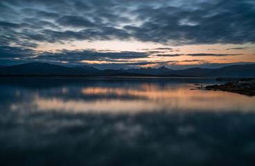 View of the fjord from Tromso on the island of Tromsoja, Norway during sunset