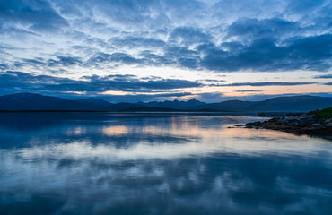 View of the fjord from Tromso on the island of Tromsoja, Norway during sunset