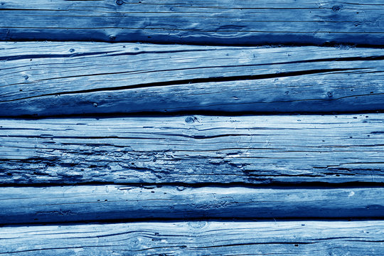 Old grunge wooden wall pattern in navy blue color.