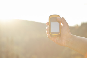 Tourist holding gps tracker. Finding right way.