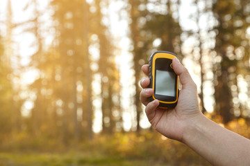 Tourist holding gps tracker. Finding right way.
