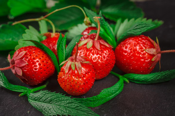 Fresh strawberry on gray background close up