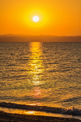 Fototapeta premium Early morning , dramatic sunrise over sea and mountain. Photographed in Asprovalta, Greece.