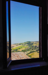 Window with a view on countryside across of Umbria and Tuscany regions