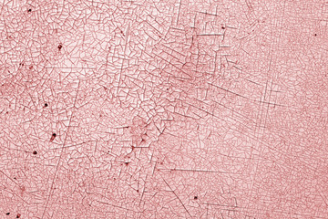 Crack and damage on painted texture in red tone.