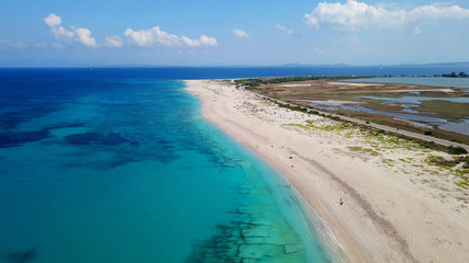 Fototapeta na wymiar Aerial bird's eye view photo taken by drone of tropical white sandy beach with turquoise clear waters