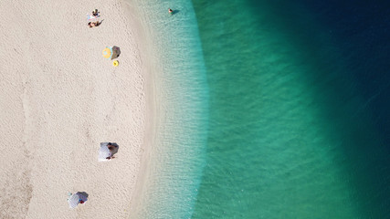Aerial drone bird's eye view of famous and exotic sand tongue beach with clear emerald waters near...