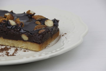 Almond Chocolate Brownie on White Ceramic Plate