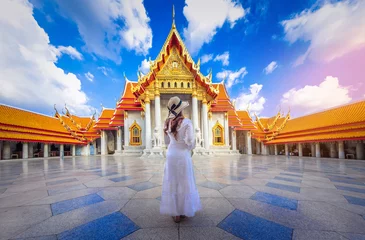 Foto op Canvas Asian woman tourist visit the beauty of Wat Benchamabophit,Bangkok thailand. © chanchai