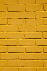 texture of a yellow brick wall as a background