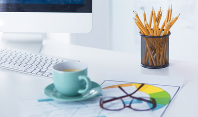 A cup of coffee on the office table