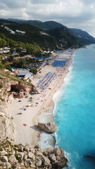 Aerial drone photo of iconic paradise beach of Kathisma with white rock steep cliff and emerald...