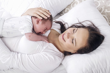 Mother  and baby in bed