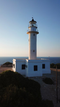 Aerial drone bird's eye view photo of iconic lighthouse in Cape Lefkada the Southest part of the island, Ionian, Greece
