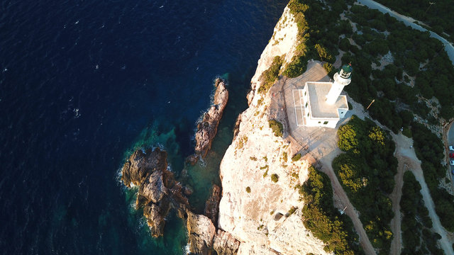Aerial drone bird's eye view photo of iconic lighthouse in Cape Lefkada the Southest part of the island, Ionian, Greece
