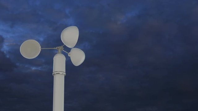 Anemometer rotates fast with stormy clouds in background. Loop ready animation of device used for measuring wind speed. 