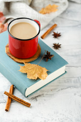 Obraz na płótnie Canvas Autumn light still life with coffee and book