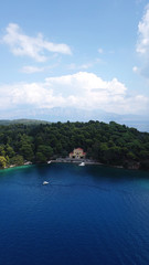 Fototapeta premium Aerial drone photo of iconic uninhabited island of Madouri in bay of Nydri and Mansion of 19th-century poet Aristotelis Valaoritis, Lefkada, Ionian, Greece