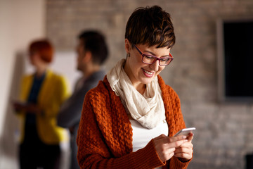 Young businesswoman using mobil phone.