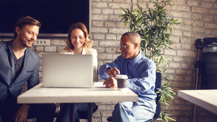 Business woman presenting project on computer talking and sharing ideas.