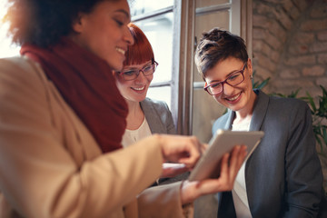 three businesswomen working together in office.